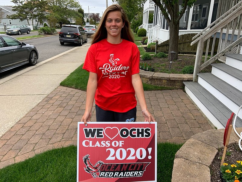 Brynn Bowman, 18, of Ocean City, displays her Class of 2020 lawn sign she picked up with her other graduation items.