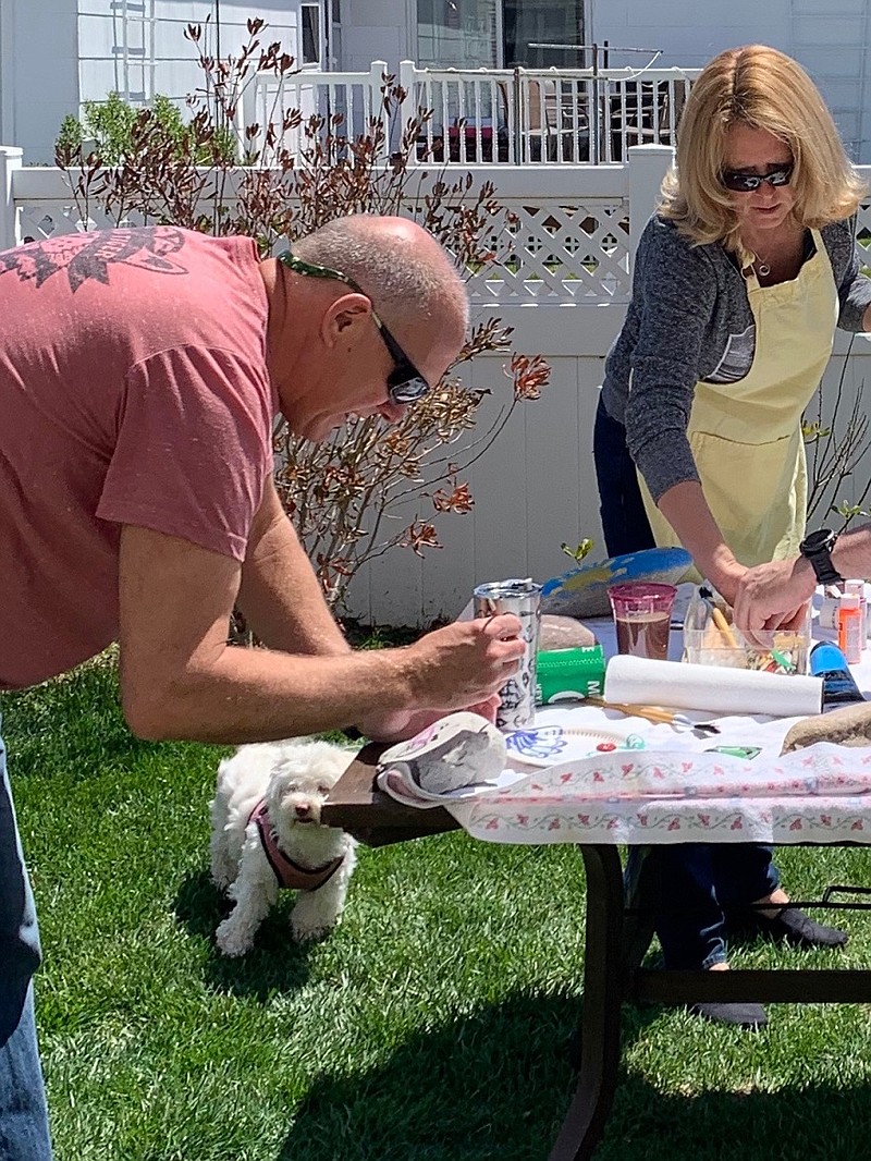 Bruce and Charlene Twiggs do their artwork in their back yard.