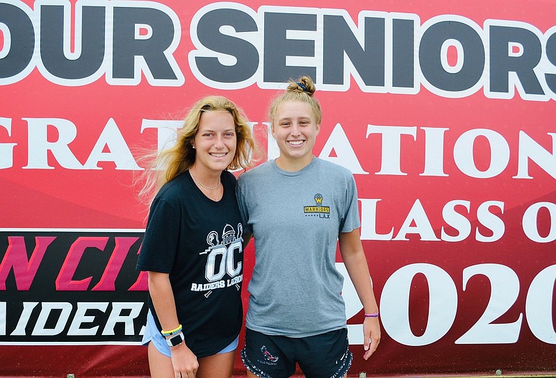 Ocean City High School lacrosse players Chloe Prettyman, left, and Abbey Fenton will continue their academic and athletic careers in college. (Photo courtesy of Warrior Lacrosse Program)