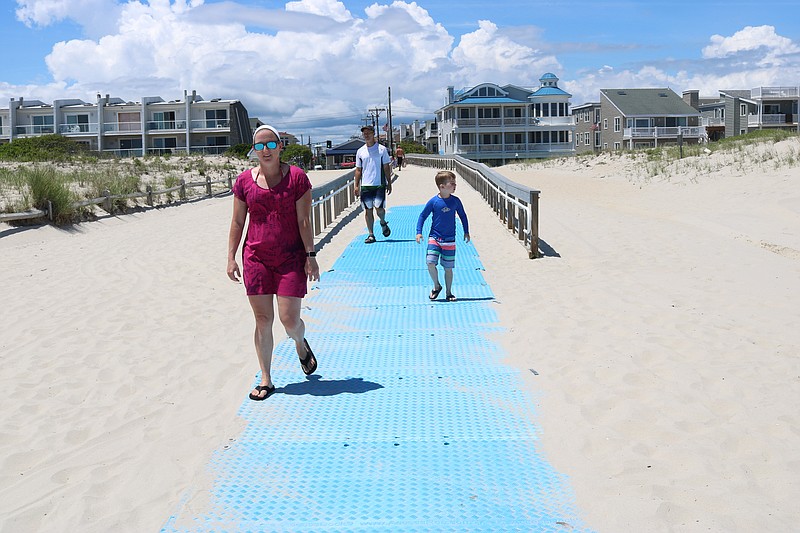 Beachgoers enjoy a sun splashed Father's Day in Ocean City.