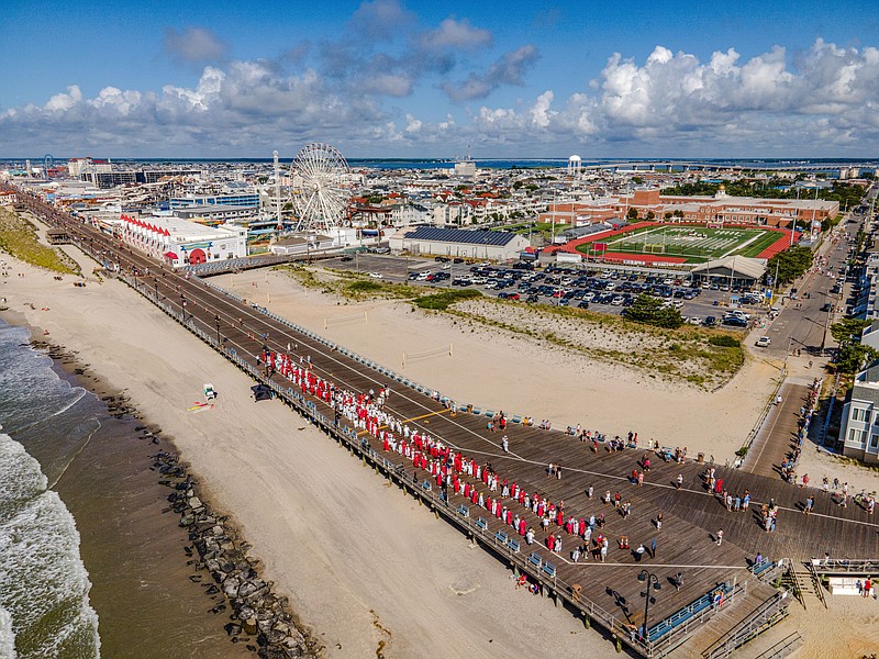 A drone shot shows the graduates lining up on the Boardwalk at the beginning of the procession. (Courtesy of JASM Consulting)