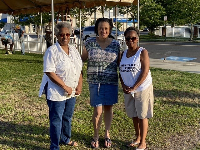 Organizers (from left) Loretta Thompson Harris, Shari Thompson and Alva Thompson prepare for Sunday’s tent service at Tabernacle Baptist Church.