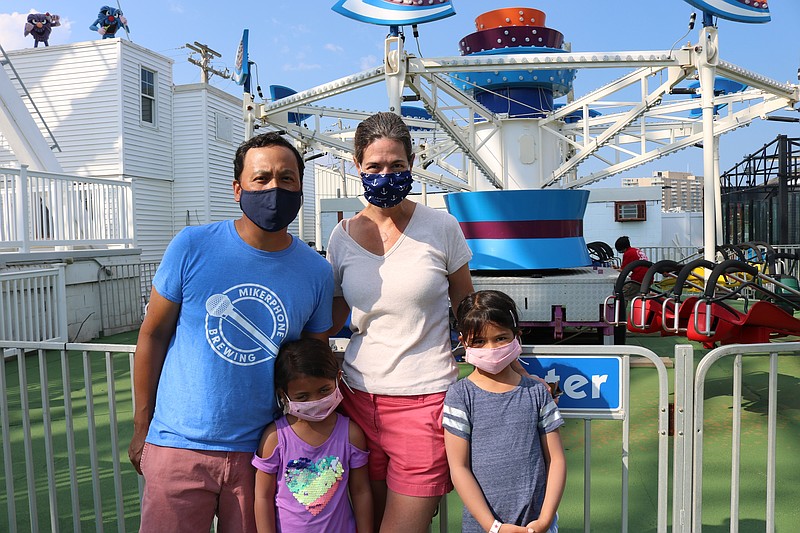 Jay Ablian, and his wife, Stacie Frank, of Chicago, with daughters, Grace, 5, and Alexandra, 6, spend an evening at Gillian's Wonderland Pier. 