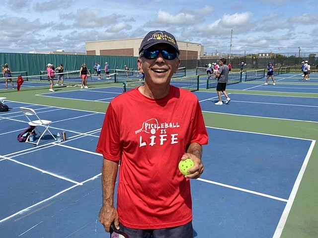 Nick Puschak’s shirt advertises his Facebook page, “Pickleball is Life.”