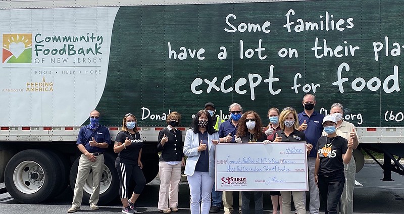 Sturdy Savings Bank’s Trina McSorley and Jann Mevoli present a donation to Community FoodBank of N.J.’s Denise Hladun and Christy Fernandez. (Photo courtesy of Suasion Communications)