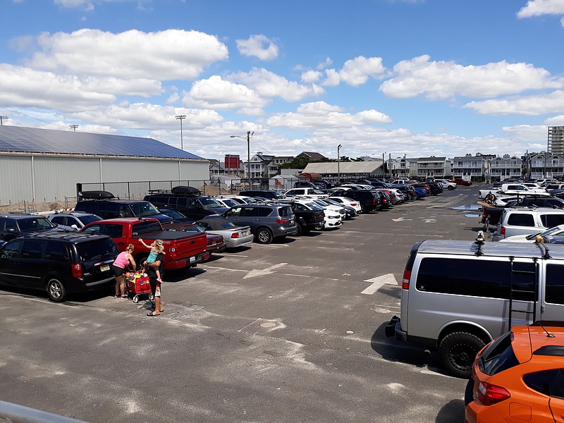 Public parking is always at a premium in the summer season, such as this lot at Fifth and Sixth streets.