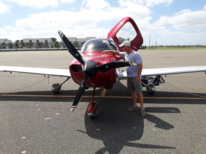 Pilot Joe Fornara checks out his Cirrus SR20 before a flight from Ocean City Municipal Airport.