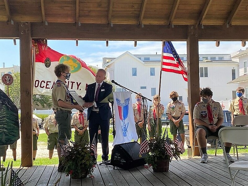 Eagle Scout Caleb Schumacher, of Ocean City, receives an honor from Congressman Jeff Van Drew during a ceremony at the Bayside Center Pavilion. (Photo courtesy Bill Schumacher)