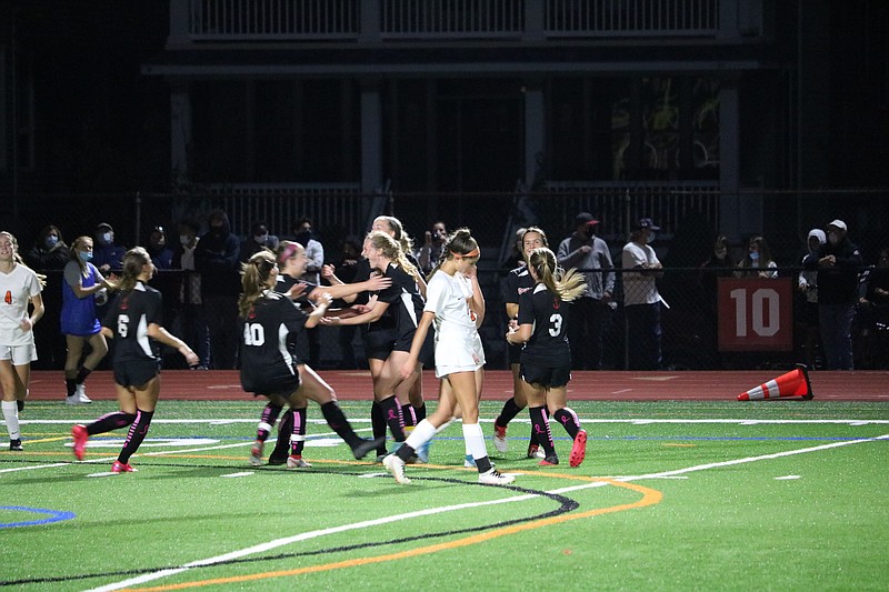 The Red Raiders celebrate after senior Suzy Dietrich's goal.