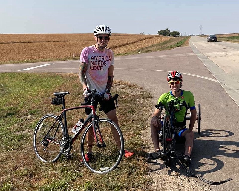 Jared Fenstermacher, right, is completing his cross-country trip to Ocean City using a bicycle propelled by his hands. (Photo courtesy of Ocean City Regional Chamber of Commerce)