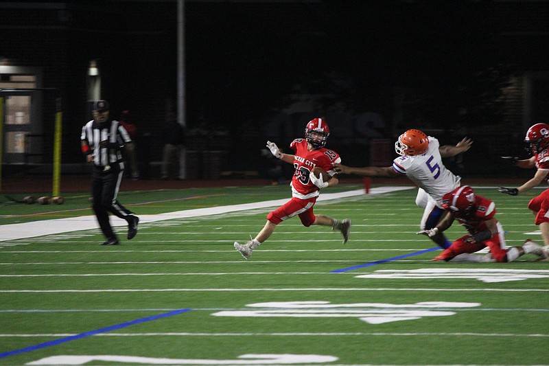 Jack Schneider eludes a Millville tackler.