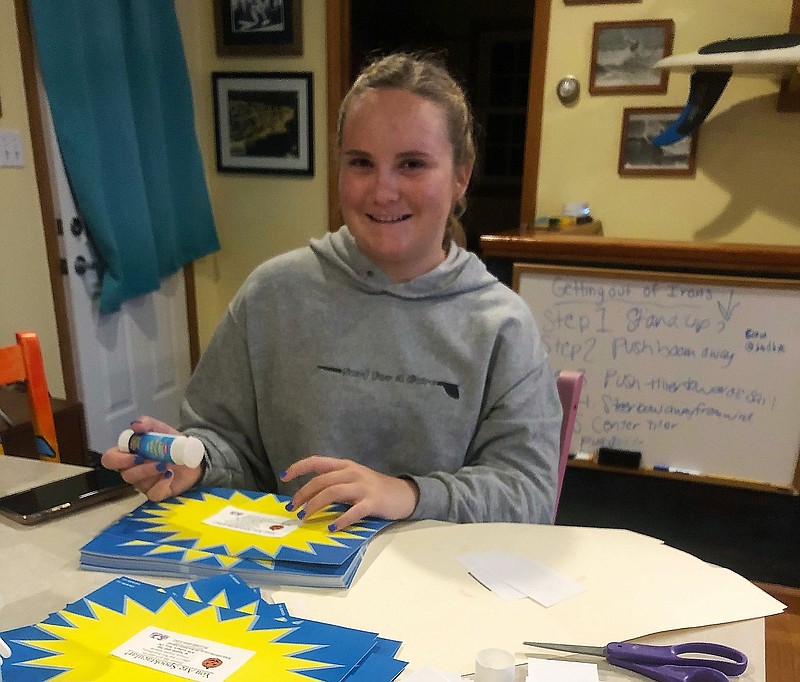 Ocean City High School freshman Kelsey Bowman makes the Spoon &amp; Sip Treat Certificates to give to Primary School students. (Photos courtesy OCNJ CARE)