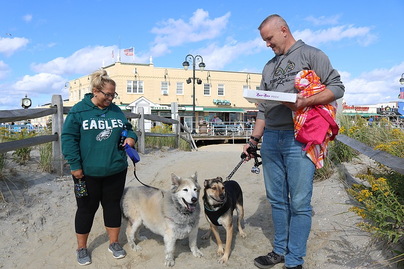 Melinda Yannick and her boyfriend, Colin Devenny, both of Phoenixville, Pa., enjoy a weekend getaway to the shore with their dogs, Jacks and Comet.