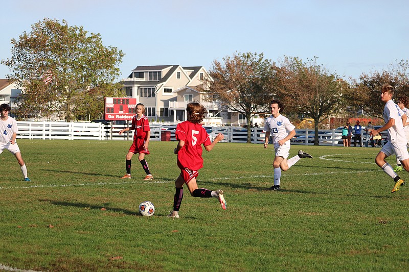 Kai Lindsay (5) looks to move the ball to teammate Wade Hudak (4). Both freshmen started for the Red Raiders.