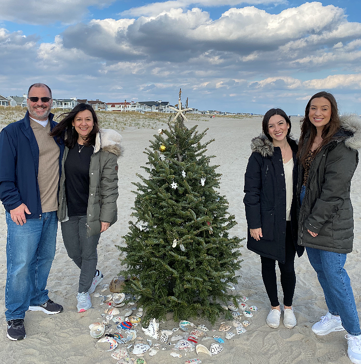 Charles Lanzalotti, of Washington Township, his wife, Tara, and their daughters, Annalisa and Sophia, pose next to the south end Christmas tree. (Photo courtesy of the Lanzalotti family)