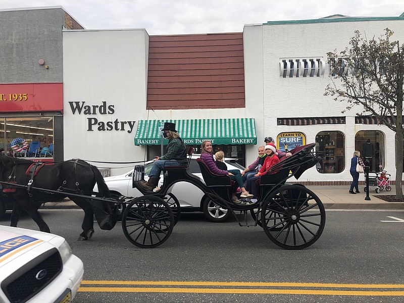 Free horse and carriage rides add to the downtown's festive atmosphere.