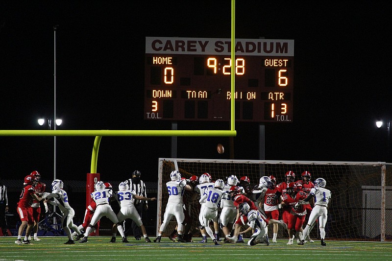 Williamstown kicks the extra point after scoring its first touchdown.