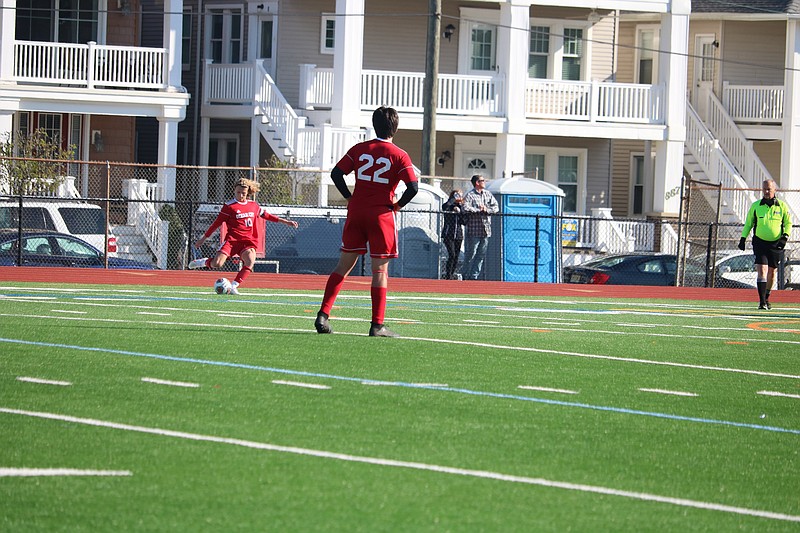 Ocean City's Reed Lindsay (10) boots the ball into play on a corner kick.