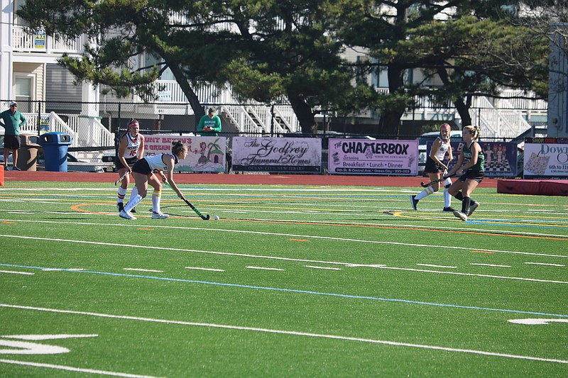 Ocean City senior captain Tara McNally, with the ball, eyes up the goal for one of her four scores.