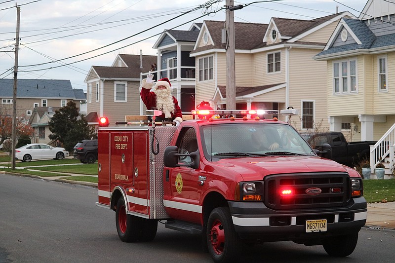 Santa makes his way through the Merion Park neighborhood.