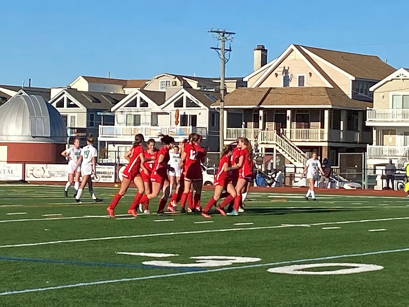 The Red Raiders celebrate their first goal of the game.