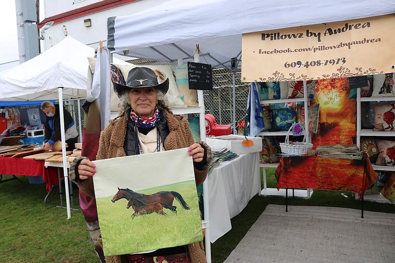 Andrea Freda displays artwork on what will be made into a pillow during the first Winterfest by the Sea in 2020.