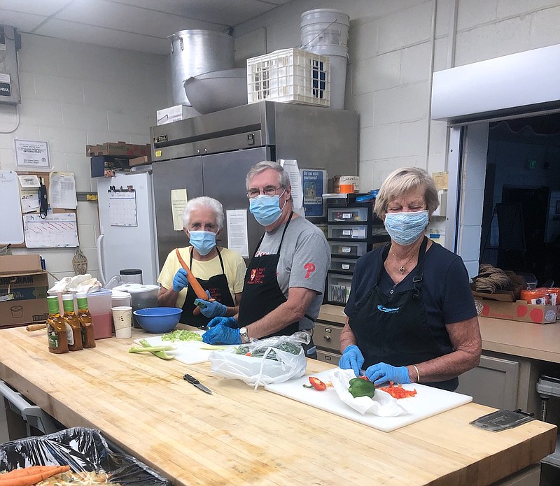 Volunteers Kathy Thompson, left, 
Bob Macnamara and 
Joanne Budnick start Thanksgiving dinner preparations Monday at St. Peters United Methodist Church. (Photos courtesy Jen Bowman)