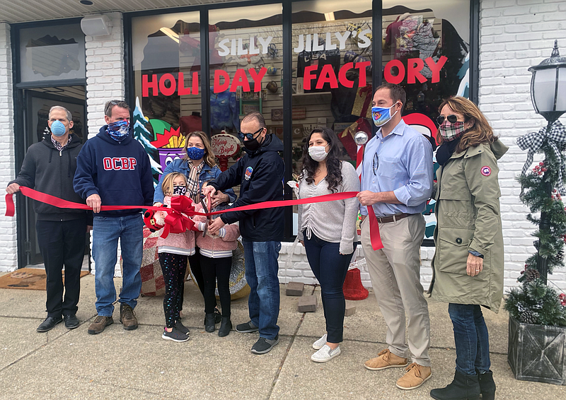 From left, city official Michael Allegretto, Mayor Jay Gillian, Jill and Jody Levchuk and their daughters, Leni and Jordyn, Downtown Merchants Association President Danielle Guerriero, Councilman Pete Madden and Chamber of Commerce Executive Director Michele Gillian. (Photo courtesy JASM)