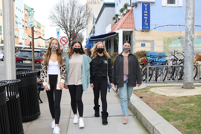 From left, Ocean City High School students Julia Keich, Chloe Howard, Carly Gallagher and Ciera Howard, all from Upper Township, take a walk downtown before spending a quiet New Year's Eve with family.