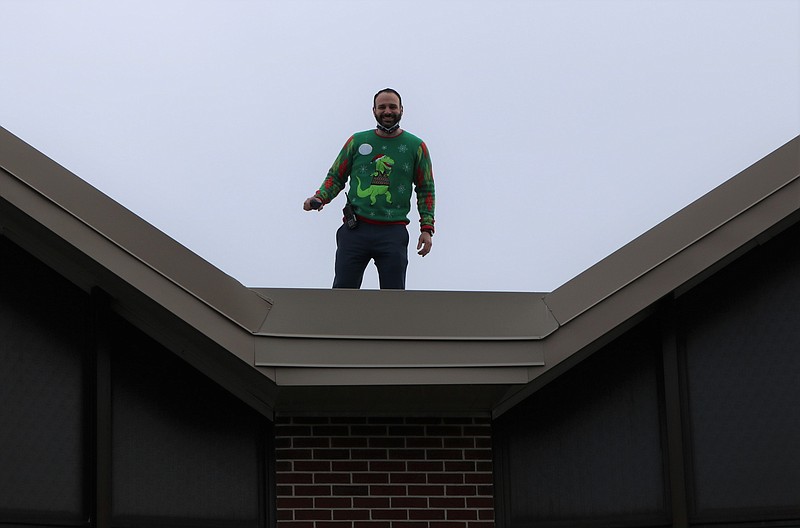 Intermediate School Principal Michael Mattina gets a bird's eye view of Santa.