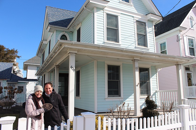 Sarah Ellis and Michael  Pinto hold the historic plaque for their home at 409 Fifth Street. (Courtesy of City of Ocean City)