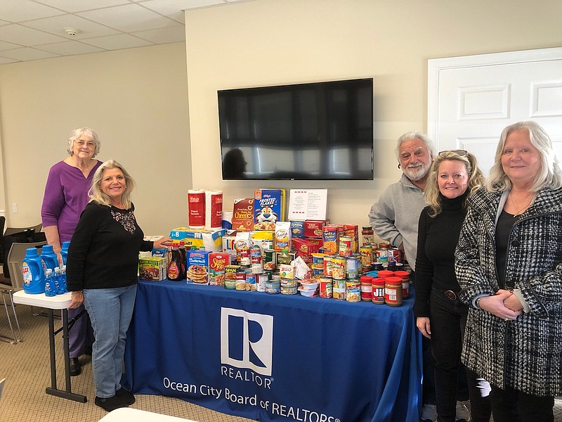 Pictured in the February 2020 food drive from left, Dottie Cianci  of the Ecumenical Council and Board of Realtors members Gloria Votta, Nick Marotta, Ellen McGonagle and Kathy DiGuigliamo. (Photo courtesy Gloria Votta)