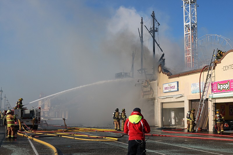 Multiple agencies investigate the Jan. 30 fire at Playland's Castaway Cove on the Ocean City Boardwalk.