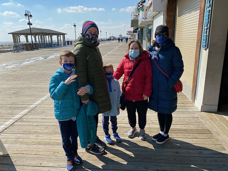 Friends Shannon (second from left) Sharon (right) and  their kids pause for a Boardwalk photo.