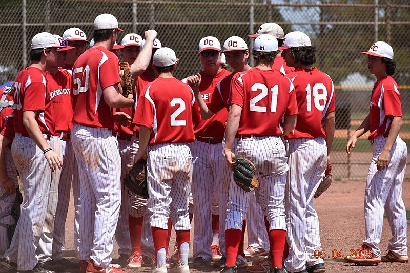 Ocean City Head Coach Andrew Bristol confers with his players during a 2018 game. 