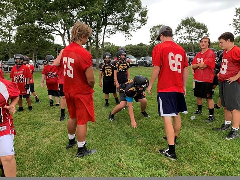 Off-season activities, such as the Red Raiders' participation in a youth clinic, are highlighted on the new www.ocfootball.com website. 