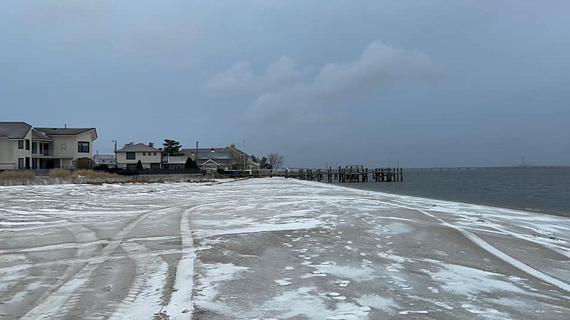 Snow-coated beaches make for a chilly scene in Ocean City during Thursday's storm.