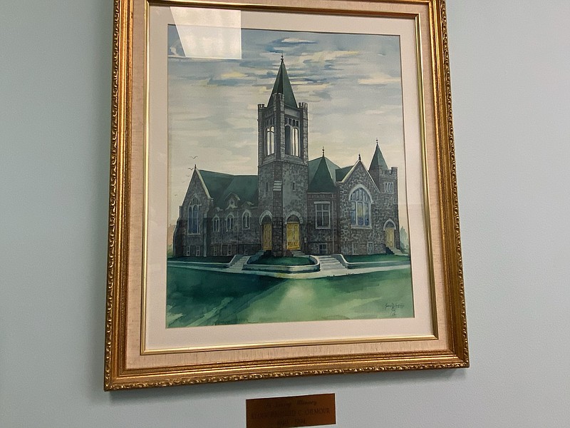 A painting inside the North Tower shows what the church looked like before a lightning bolt ripped off the spire in 1925.