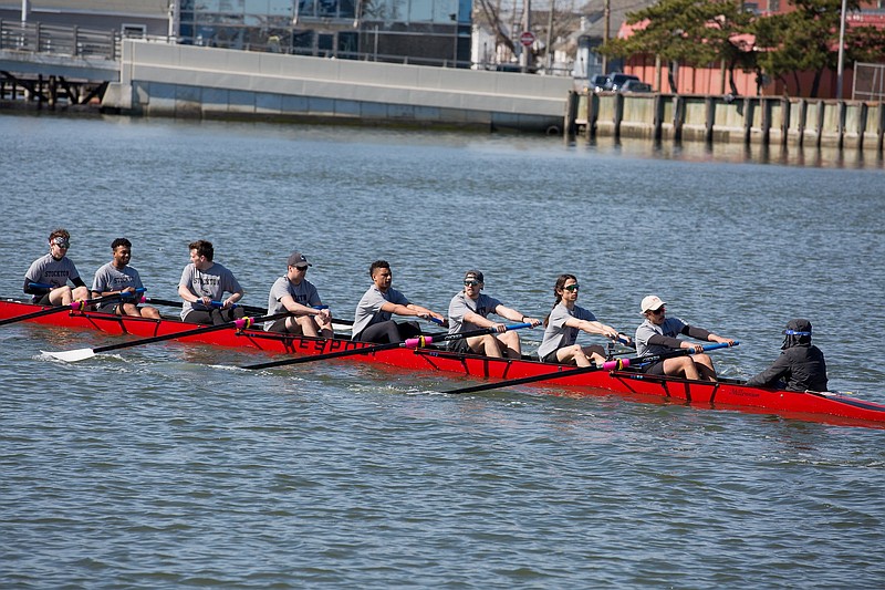 The Stockton University Men’s Rowing Club at the boathouse.