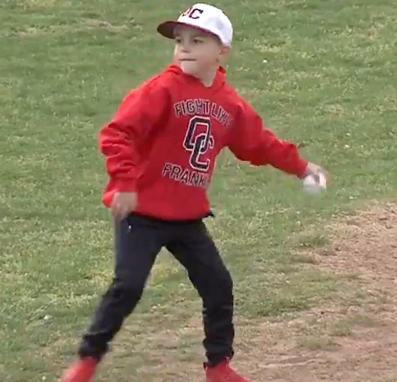 Frankie throws out the first pitch at Coaches vs. Cancer Showcase last week.