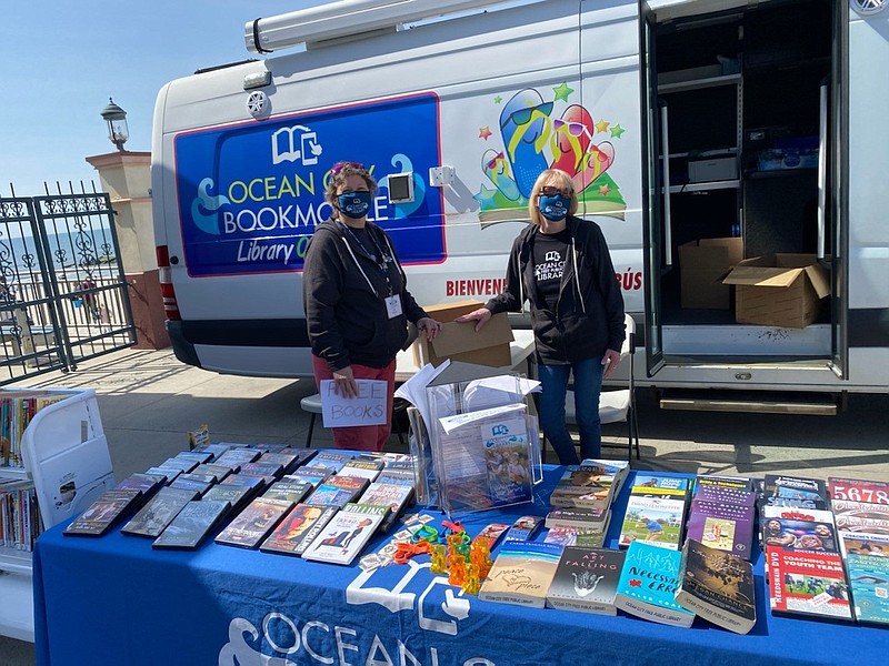 Sue Fox and Anna Degand of the Ocean City Free Public Library run a book sale at the Music Pier’s entrance during the memorabilia show.