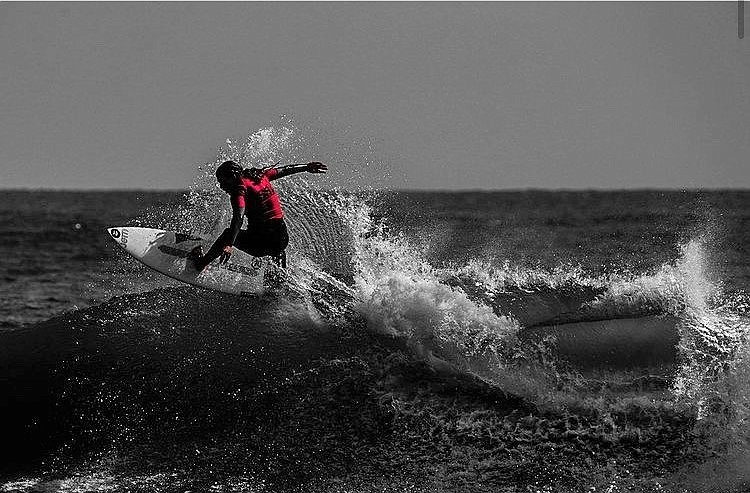 Mia Gallagher rides a wave in New Smyrna Beach, Fla. (Photo courtesy of venspiration)