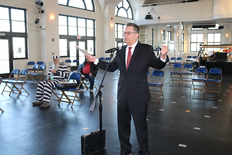 John Walton, organizer of the Business Persons Plunge, hypes the madcap event during remarks at the City Council meeting on Thursday.