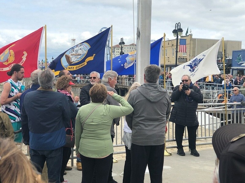 Families of the late service men attend the program.