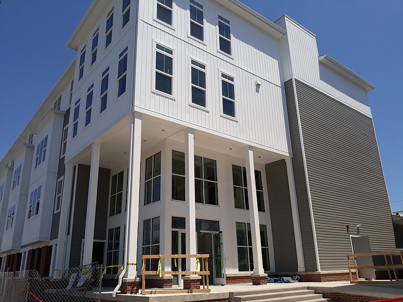 The front entrance of the building is decorated with large windows.