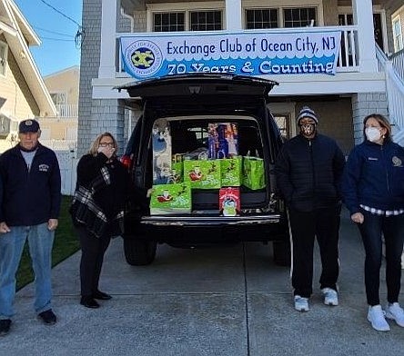 Exchange Club members gather in December to distribute Christmas toys to needy children. 