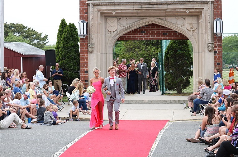 Jake Schneider and Sadie Godfrey walk the Red Carpet with their friends and classmates. 