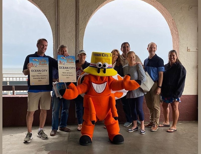 City dignitaries hold up the "Favorite Beach" certificates. (Photo courtesy of the Chamber of Commerce)