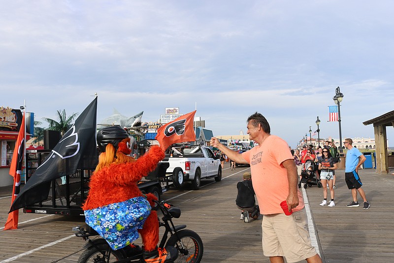 Gritty gives Jeff Smith, of Florida, a fist bump.