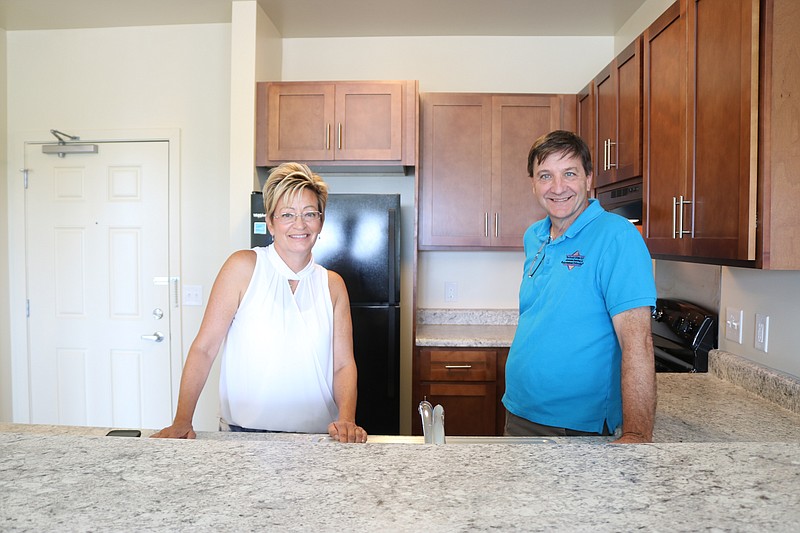 Jacqueline Jones, executive director of the Ocean City Housing Authority, and Rick Ginnetti, owner of the Brooke Group, stand in the kitchen of one of the units.